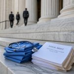 DOJ Asks SCOTUS to Ignore Fired Healthcare Workers