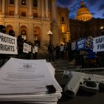 Colorado Gun Laws Surge: Polis Signs Two, More Threats Loom
