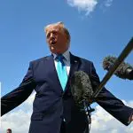 Trump signs Iran deal, defends against criticism of new memorandum