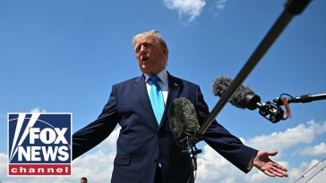 Trump signs Iran deal, defends against criticism of new memorandum