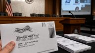 USPS Barcoded Ballots Ignite Peters' Fight Over Federal Power