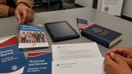 Refugee Welcome Packets Reveal PragerU, 1776 Commission Push