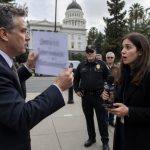 Terry Schanz flashes crude sign at reporter now facing HR complaints